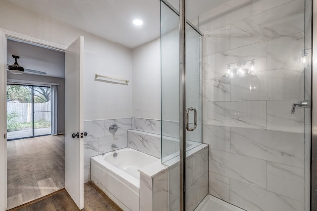 2406 Sutton Dr, Arlington, TX 76018 - bathroom with ceiling fan, recessed lighting, a shower stall, wood finished floors, and a bath