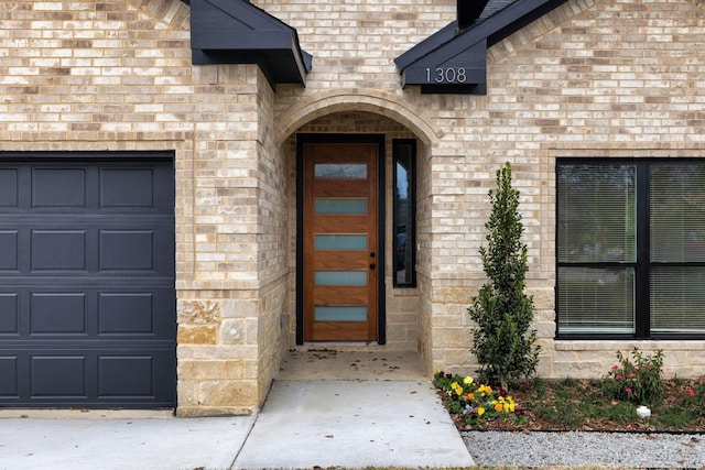 1308 Lorraine Ln, Mesquite, TX 75149 - entrance to property with an attached garage and brick siding