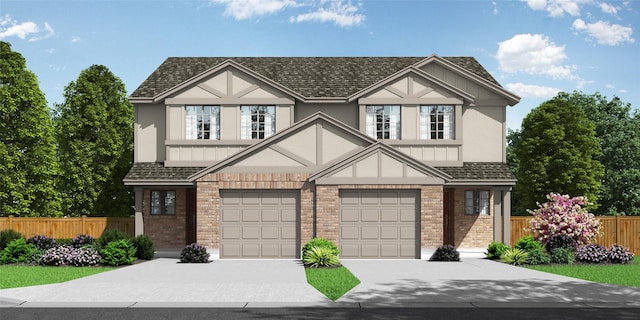 view of front of property with concrete driveway, an attached garage, brick siding, and fence