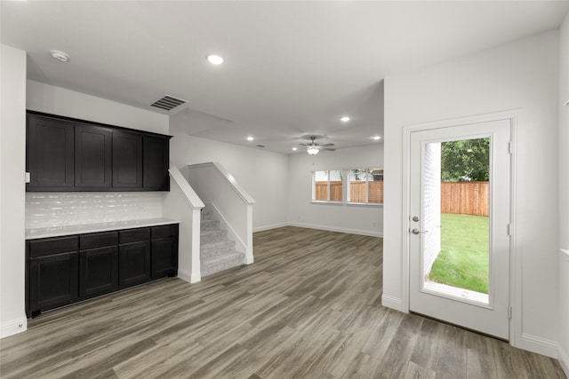 202 Griffith, Princeton, TX 75407 - unfurnished living room featuring recessed lighting, light wood-style flooring, a ceiling fan, baseboards, and stairway