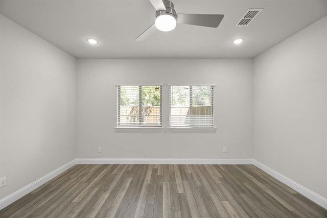 spare room with visible vents, baseboards, recessed lighting, wood finished floors, and a ceiling fan