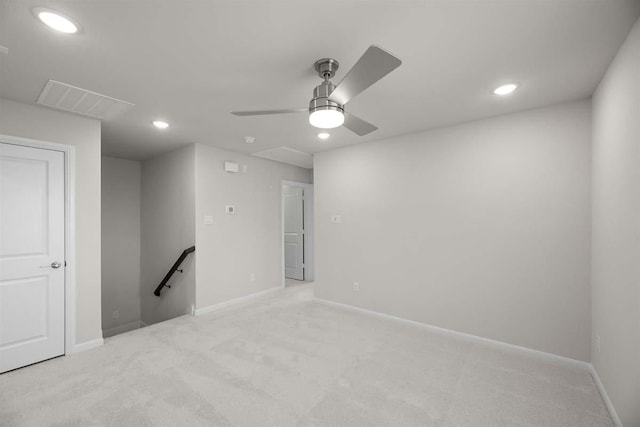 unfurnished room with visible vents, light carpet, and recessed lighting