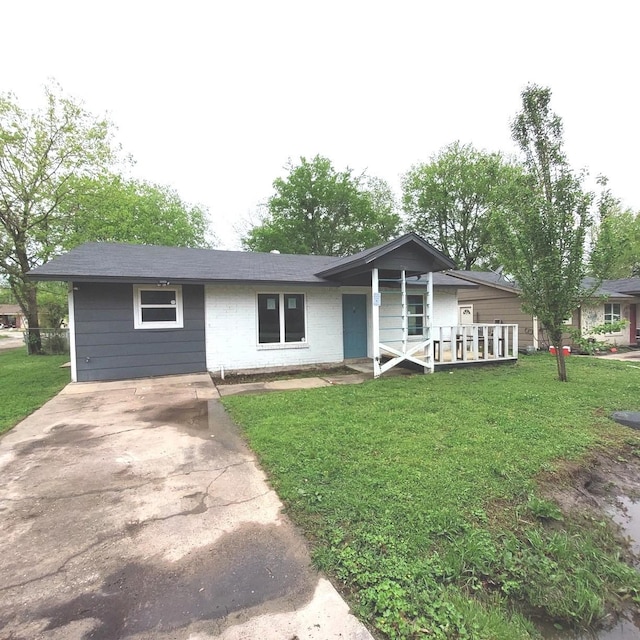 ranch-style home with a porch and a front lawn