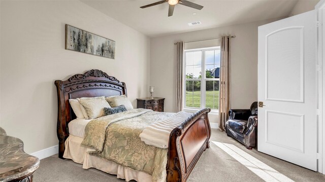 bedroom featuring baseboards, visible vents, ceiling fan, and carpet