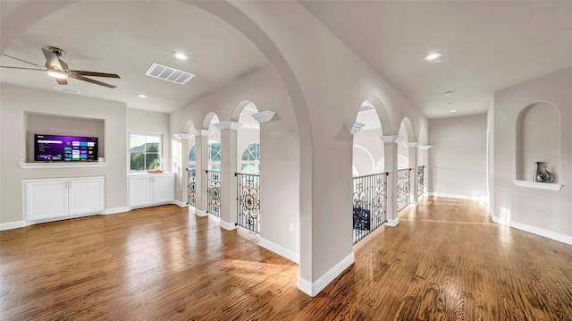 hall featuring wood finished floors, visible vents, recessed lighting, and baseboards