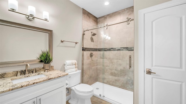 bathroom featuring recessed lighting, tile patterned flooring, a shower stall, toilet, and vanity
