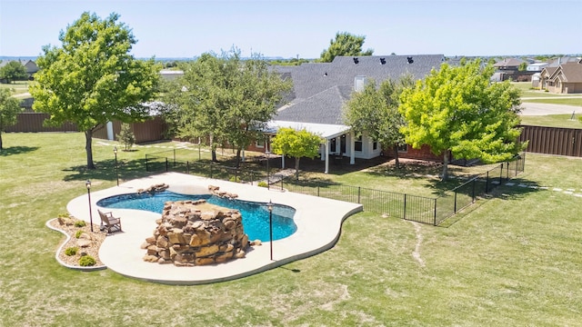 view of pool with fence, a patio area, a fenced in pool, and a lawn
