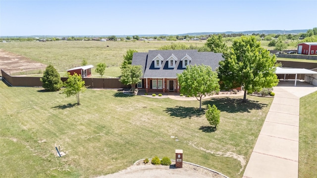 birds eye view of property with a rural view