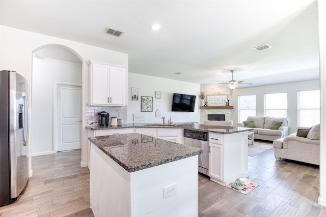 300 Copper Switch Dr, Anna, TX 75409 - kitchen featuring visible vents, ceiling fan, a peninsula, and appliances with stainless steel finishes