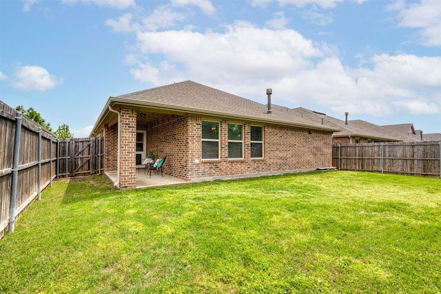 300 Copper Switch Dr, Anna, TX 75409 - rear view of property featuring a lawn, a patio area, a fenced backyard, and brick siding