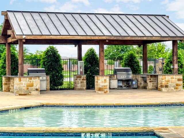300 Copper Switch Dr, Anna, TX 75409 - pool with a grill, an outdoor kitchen, and fence