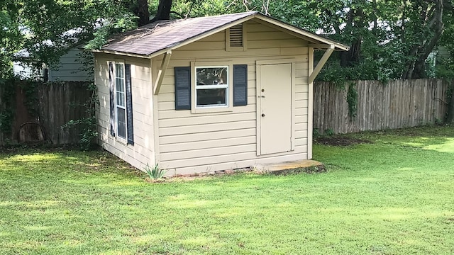 view of shed with fence
