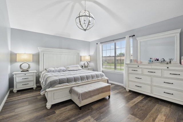 bedroom with dark wood-style flooring, a chandelier, and baseboards