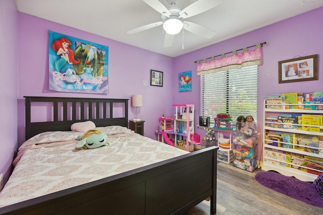 bedroom featuring wood finished floors and ceiling fan