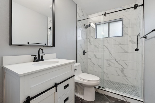 bathroom featuring a stall shower, toilet, tile patterned flooring, and vanity