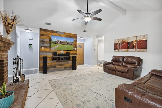 living area featuring light tile patterned floors, visible vents, a ceiling fan, and a brick fireplace