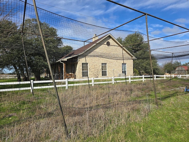 view of side of property with fence
