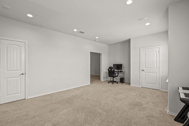 carpeted office featuring baseboards, visible vents, and recessed lighting