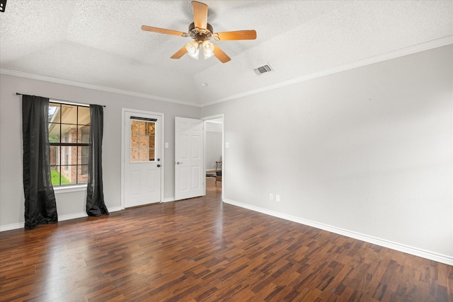 empty room featuring dark wood-style floors, ceiling fan, visible vents, vaulted ceiling, and a textured ceiling