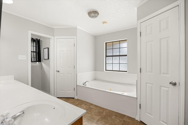 full bath with double vanity, crown molding, a whirlpool tub, and a sink