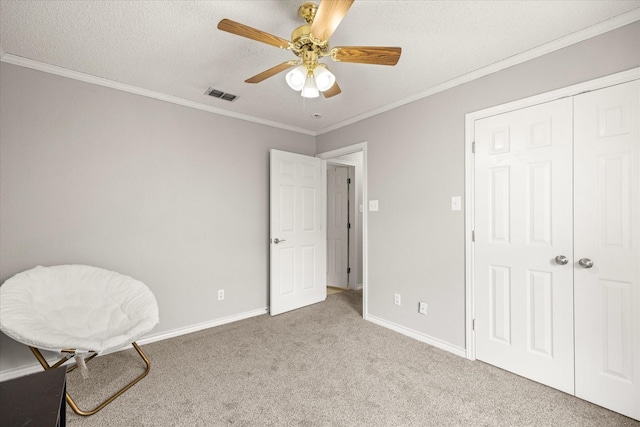 bedroom with crown molding, visible vents, carpet floors, and baseboards