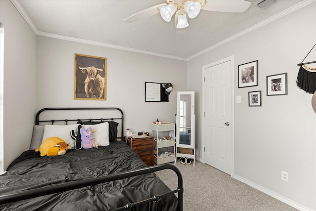 carpeted bedroom featuring a textured ceiling, crown molding, visible vents, ceiling fan, and baseboards
