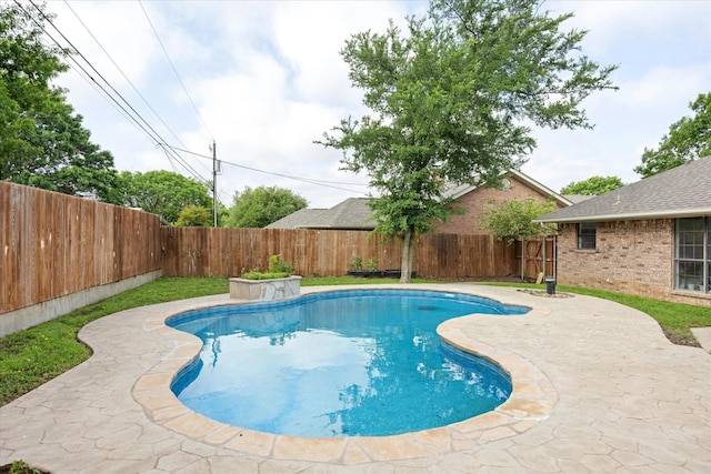 view of swimming pool featuring a fenced backyard, a fenced in pool, and a patio area