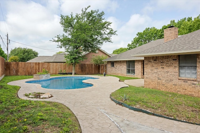 view of pool featuring a yard, a fenced in pool, a fenced backyard, and a patio area