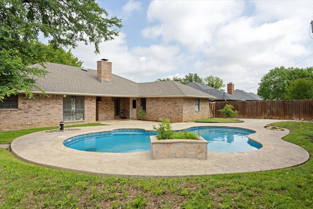 view of swimming pool with a patio, a fenced in pool, and fence