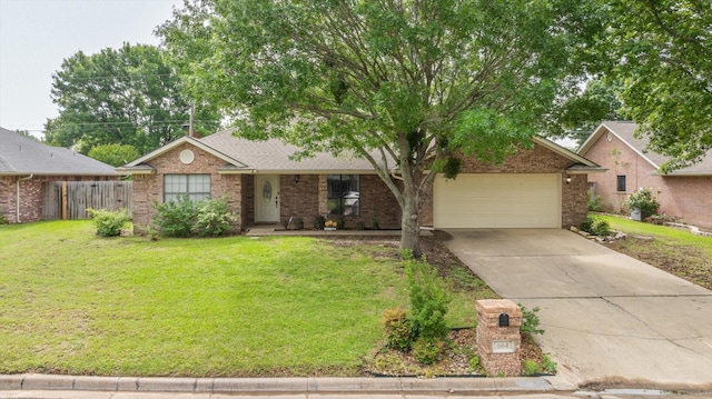 ranch-style home with driveway, a front yard, fence, brick siding, and a garage