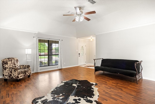 sitting room featuring wood finished floors, vaulted ceiling, baseboards, visible vents, and a ceiling fan