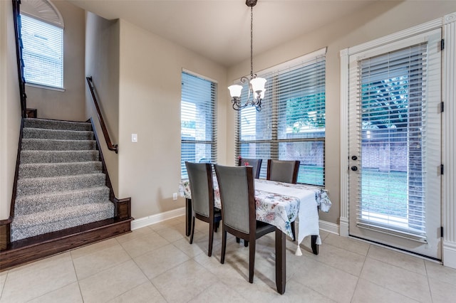 751 Chateaus Dr, Coppell, TX 75019 - dining space with baseboards, stairs, light tile patterned floors, and a notable chandelier
