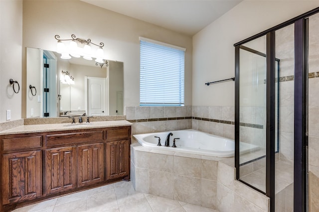 751 Chateaus Dr, Coppell, TX 75019 - full bathroom with vanity, tile patterned floors, a garden tub, and a stall shower