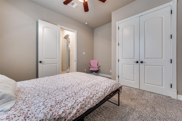 751 Chateaus Dr, Coppell, TX 75019 - carpeted bedroom featuring a ceiling fan, visible vents, arched walkways, baseboards, and a closet