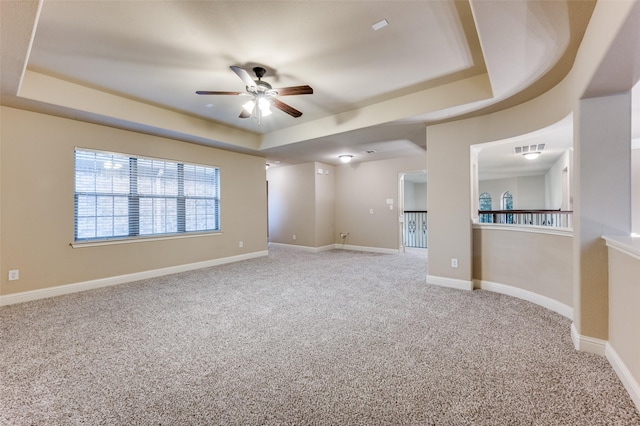 751 Chateaus Dr, Coppell, TX 75019 - empty room with a ceiling fan, visible vents, baseboards, carpet, and a tray ceiling