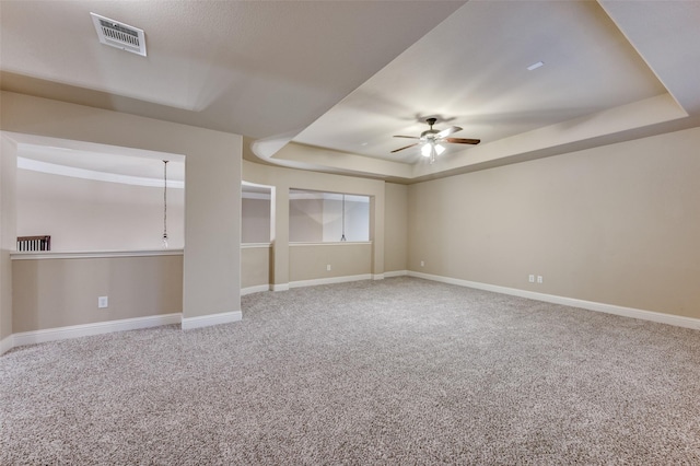 751 Chateaus Dr, Coppell, TX 75019 - carpeted empty room with a ceiling fan, baseboards, visible vents, and a raised ceiling