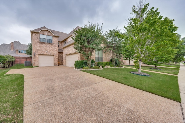 751 Chateaus Dr, Coppell, TX 75019 - traditional-style home featuring fence, a front yard, brick siding, central AC unit, and driveway
