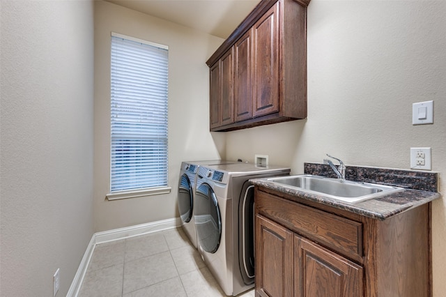 751 Chateaus Dr, Coppell, TX 75019 - laundry area with washing machine and dryer, baseboards, a sink, cabinet space, and light tile patterned floors