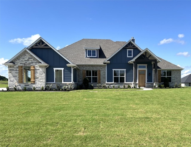 165 Cooper, Van Alstyne, TX 75495 - craftsman house with board and batten siding, a chimney, a front yard, and stone siding