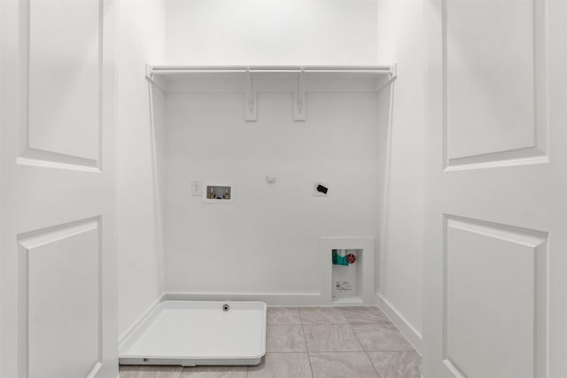 723 Tower Rd, Wylie, TX 75098 - clothes washing area with gas dryer hookup, hookup for an electric dryer, hookup for a washing machine, and baseboards