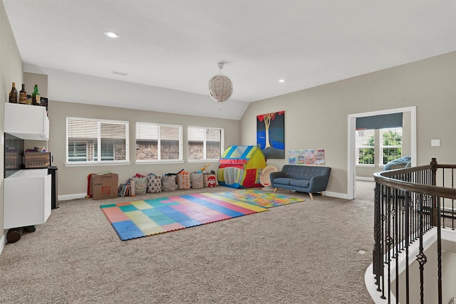 12810 Avanti Dr, Frisco, TX 75035 - playroom with visible vents, arched walkways, a healthy amount of sunlight, and light carpet