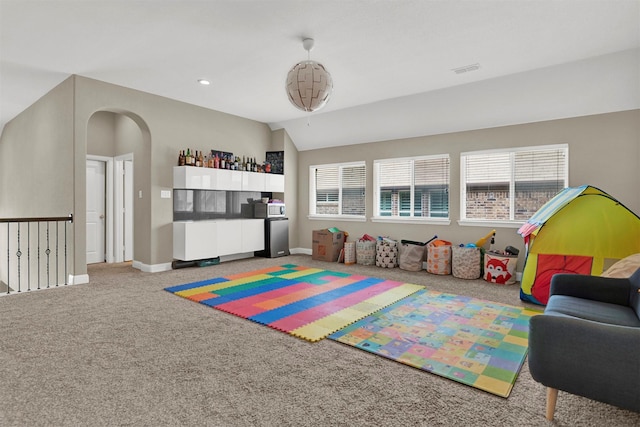 12810 Avanti Dr, Frisco, TX 75035 - playroom with arched walkways, carpet, recessed lighting, and a notable chandelier