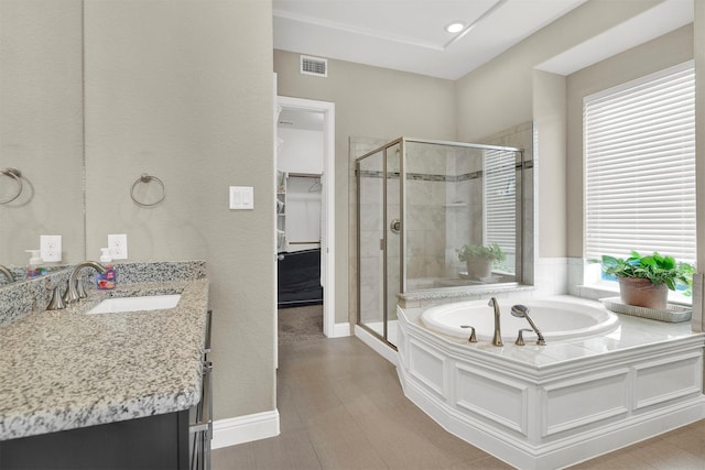 12810 Avanti Dr, Frisco, TX 75035 - bathroom featuring a garden tub, vanity, visible vents, recessed lighting, and a shower stall