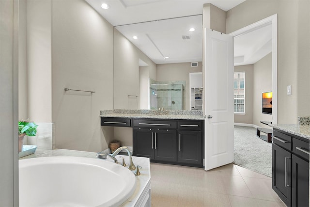 12810 Avanti Dr, Frisco, TX 75035 - bedroom with baseboards, carpet flooring, and ensuite bathroom
