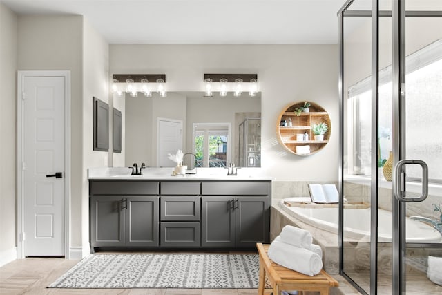 full bathroom featuring a shower stall, a sink, double vanity, a garden tub, and tile patterned flooring