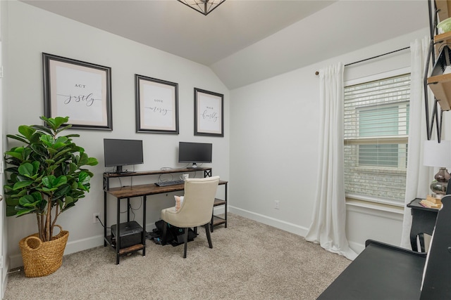 office area featuring lofted ceiling, baseboards, and carpet floors