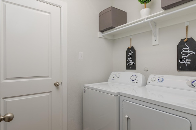laundry room with washing machine and clothes dryer and laundry area