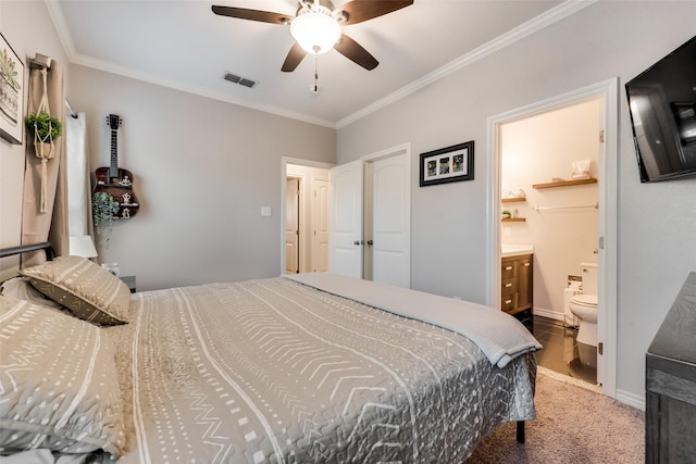 bedroom featuring visible vents, ceiling fan, ornamental molding, carpet, and ensuite bath