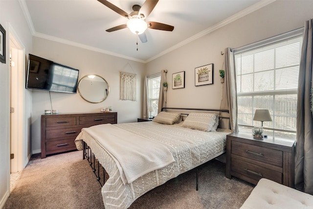 bedroom with ornamental molding, ceiling fan, and light colored carpet