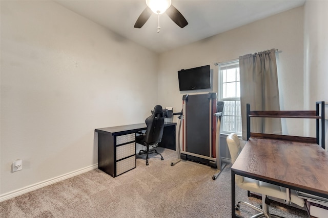 office with ceiling fan, light carpet, and baseboards